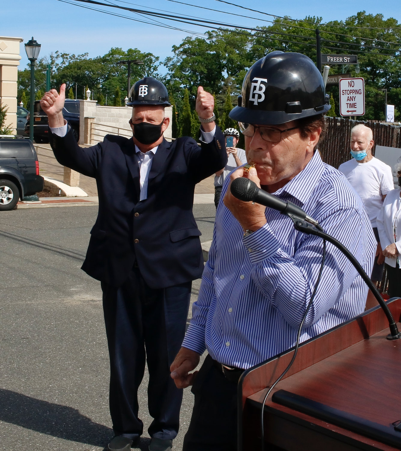 Mayor Alan Beach was presented with a golden whistle, which he blew to mark the start of demolition as Nassau County Industrial Development Agency Chairman Richard Kessel cheered.