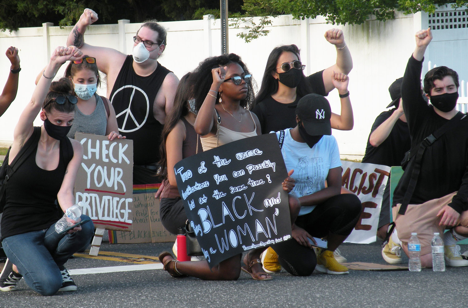 Protesters knelt to honor the Black Lives Matter movement last Saturday, as more than 100 marchers assembled and marched peacefully through Wantagh and Levittown.