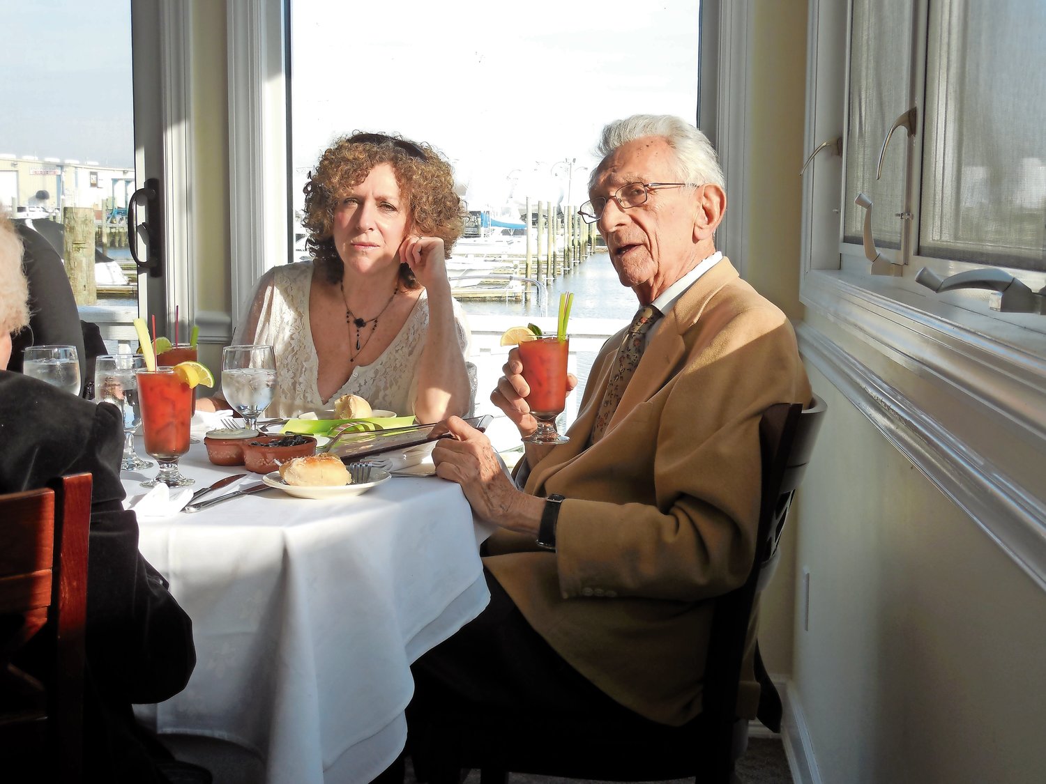 Alan Nemser, a 66-year Merrick resident, died on June 10 at the age of 106. He is pictured here at his 100th birthday celebration, with his daughter Erica Nemser-Crowley, enjoying a bloody Mary.