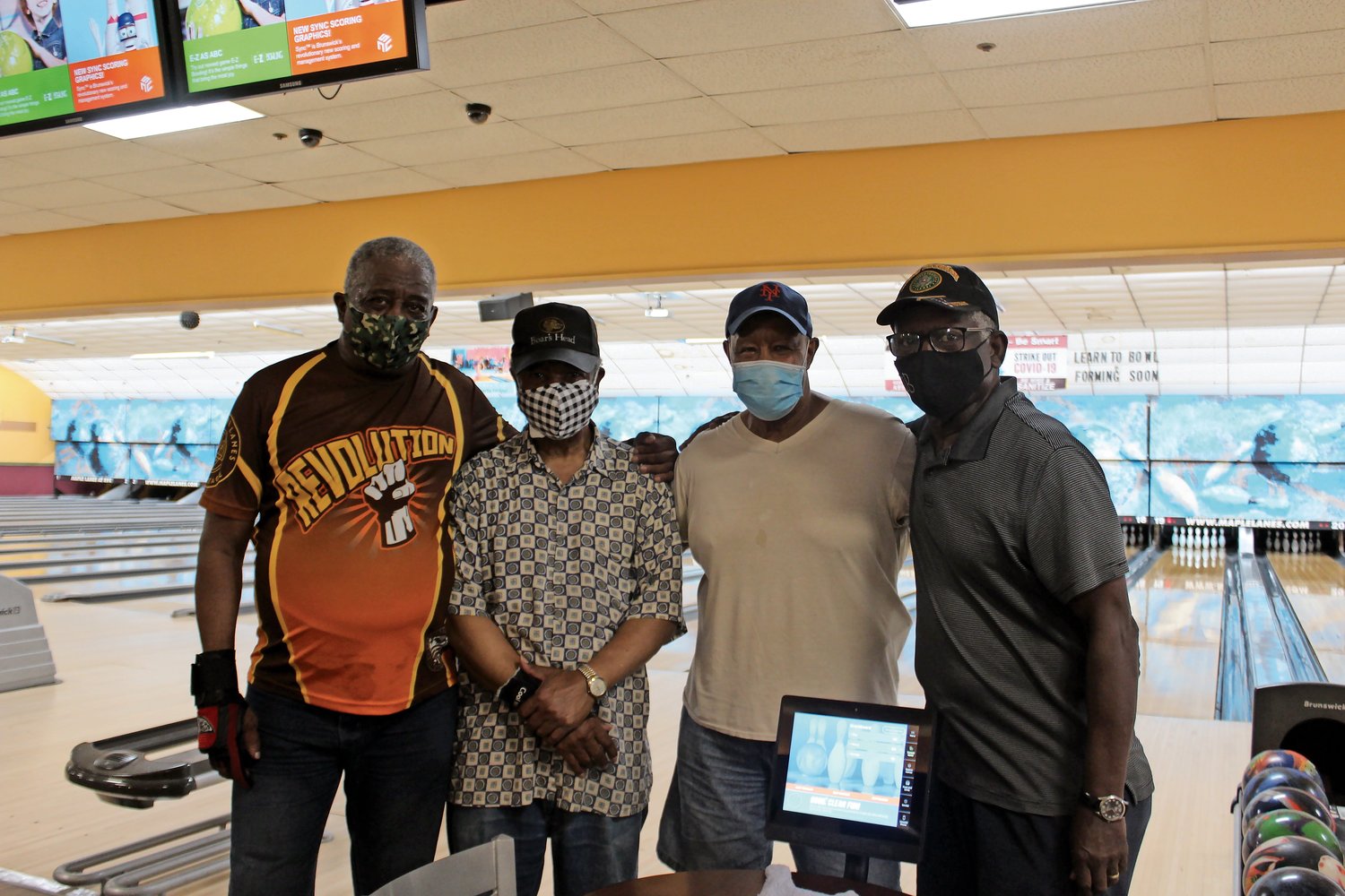 George Fields, far left, Henry Clay, Ray Lowman and Lenwood Buggie, all members of the Senior Birds league, were among the first bowlers at Maples Lanes when it reopened on Monday.