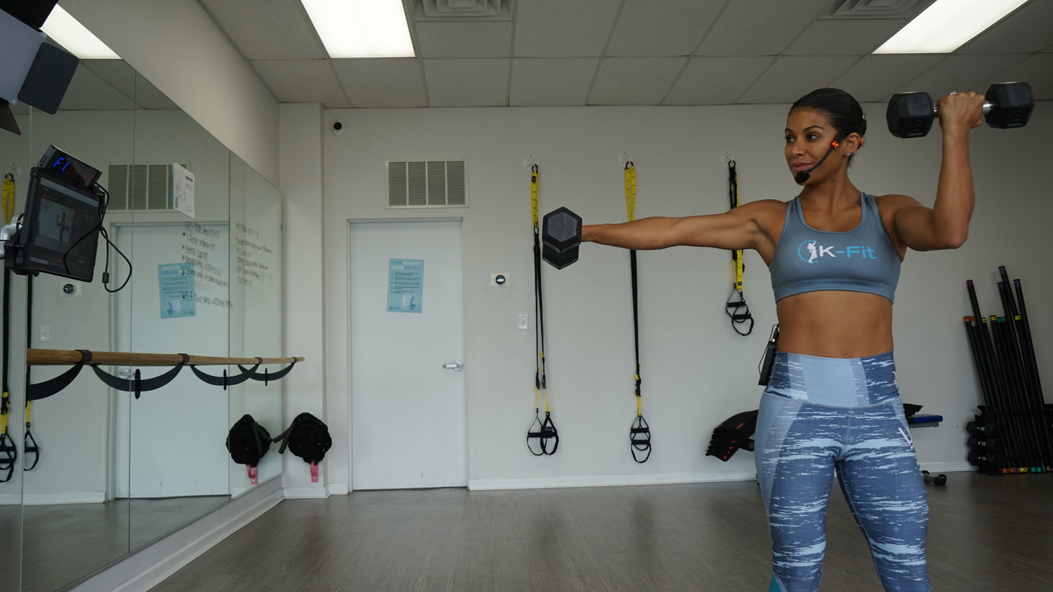 K-Fit Boutique Gym owner Karina Melo demonstrated how she has been conducting her daily virtual workout classes since pandemic forced the closure of her studio space. She plans to reopen in phases as restrictions loosened on Monday, Aug. 24.