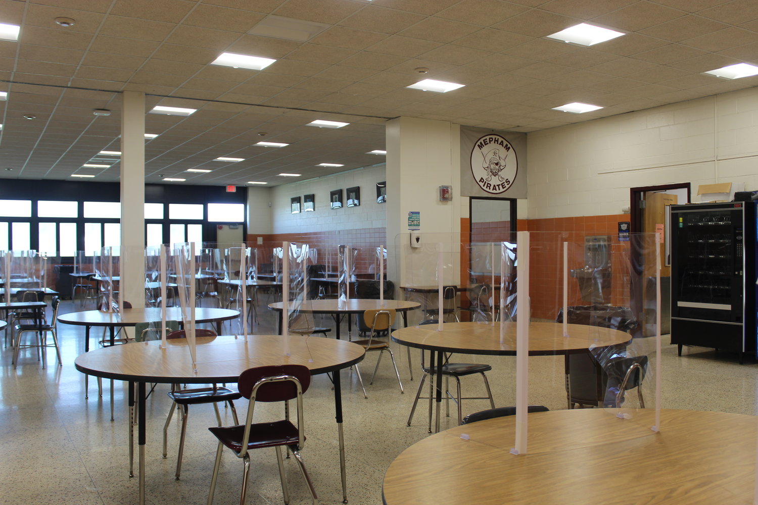 At Mepham, students can sit two to a table during lunch since each table is affixed with plastic barriers.