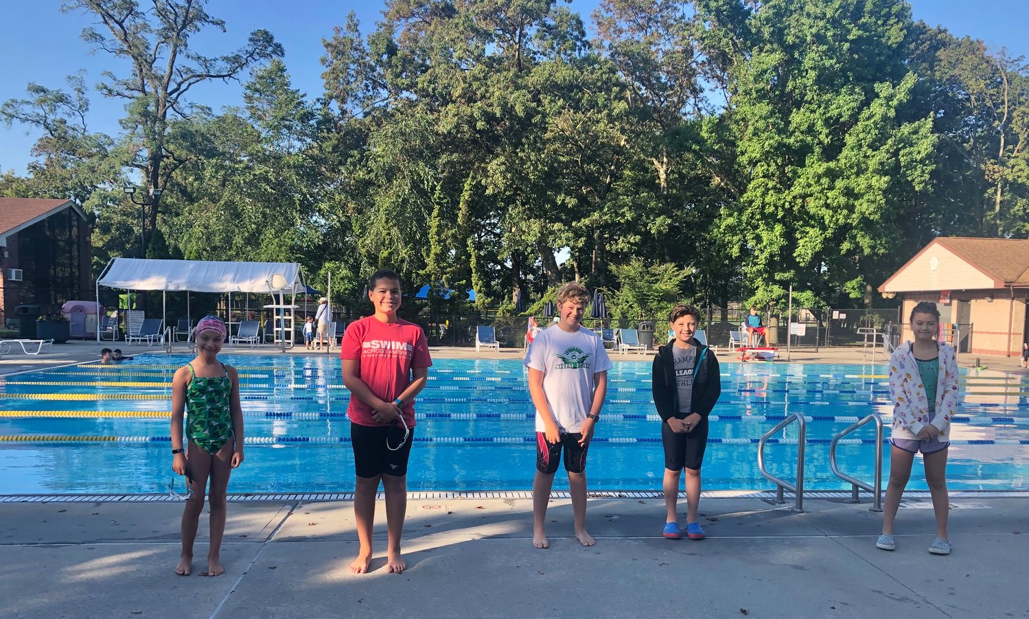 Lynbrook residents, above from left, Rebecca Wolk, Jason Diaz, Joseph Wolk, and Steven and Sofia Michelakos raised $1,600 for cancer research as part of Swim Across America.