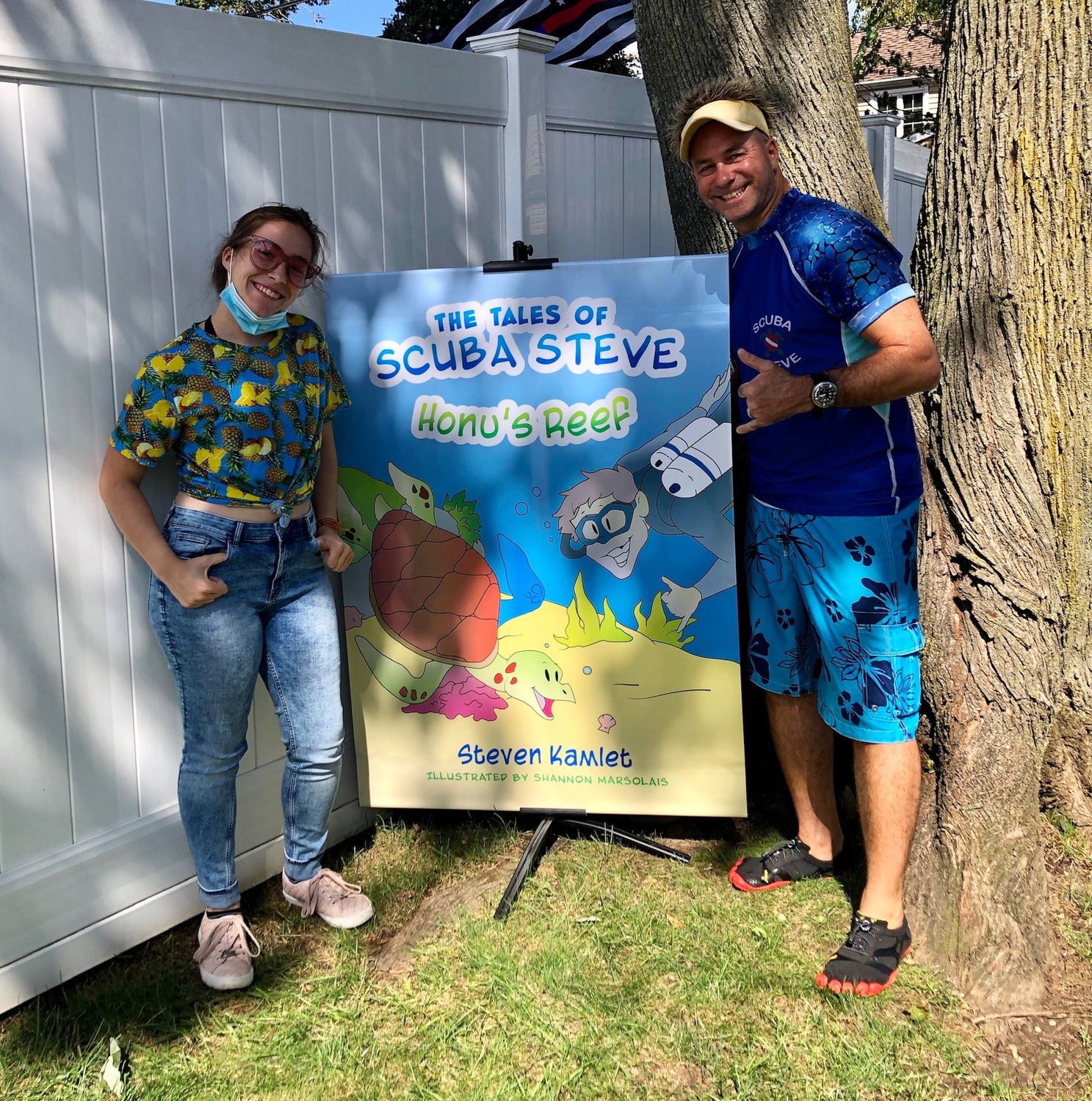 North Merrick resident Steven Kamlet, right, has written a children’s chapter book called “The Tales of Scuba Steve,” with illustrations by East Meadow High School student Shannon Marsolais.
