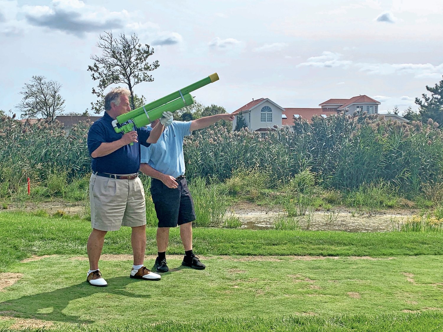 Michael Sapraicone, president and CEO of Squad Security, took aim at the Seawane Club’s 16th green with a golf ball cannon launcher.