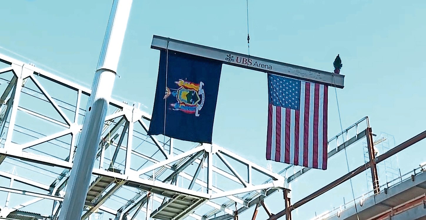 Crews placed the highest beam, signed by New York Islanders and state officials as well as the developers and union workers, atop the future UBS Arena on Oct. 9.