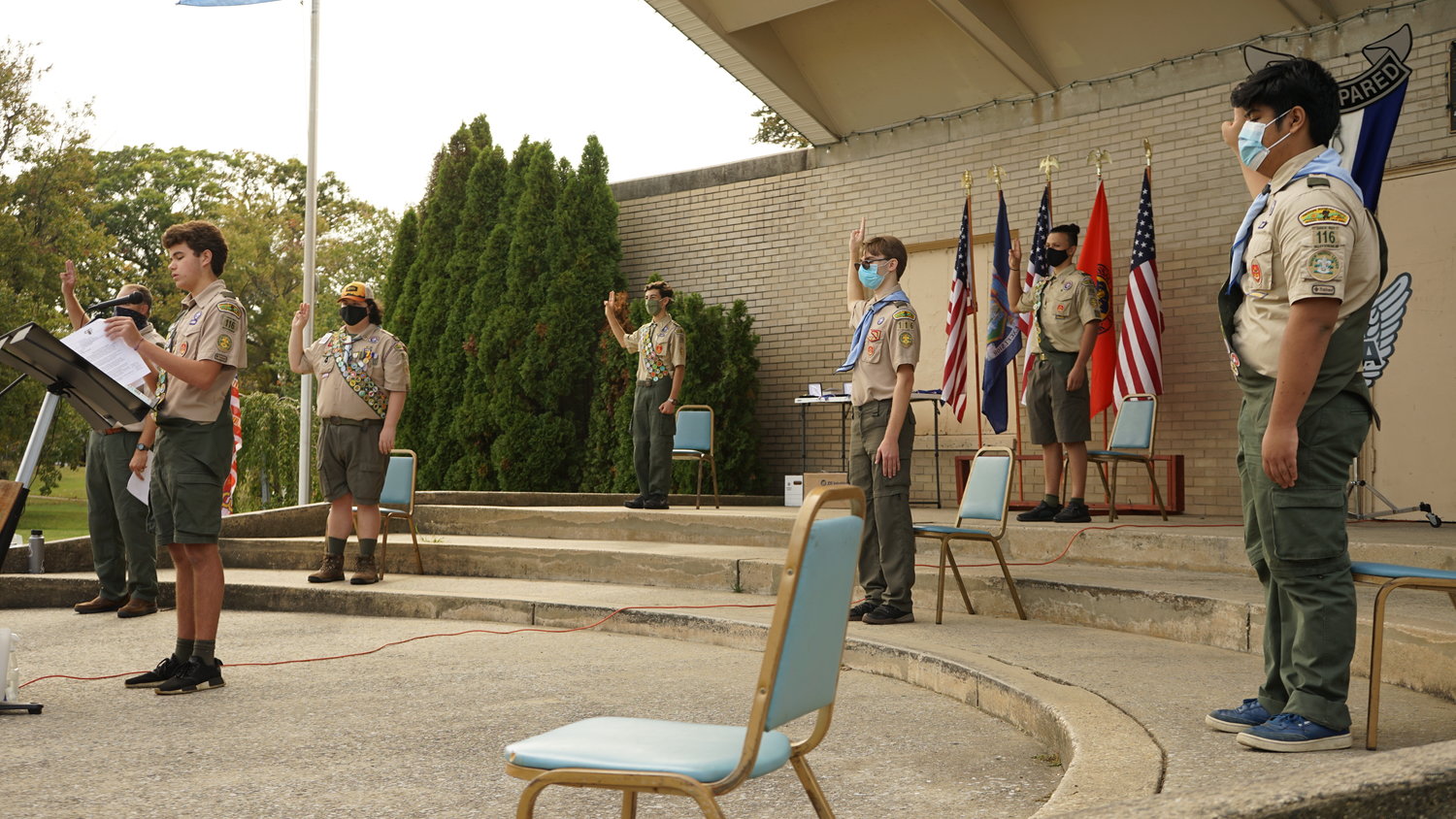 Valley Stream Troop 116 scouts Ian Burke, standing from left, Owen Bogle and Brandon Yu officially reached the rank of Eagle on Saturday, Oct. 10.
