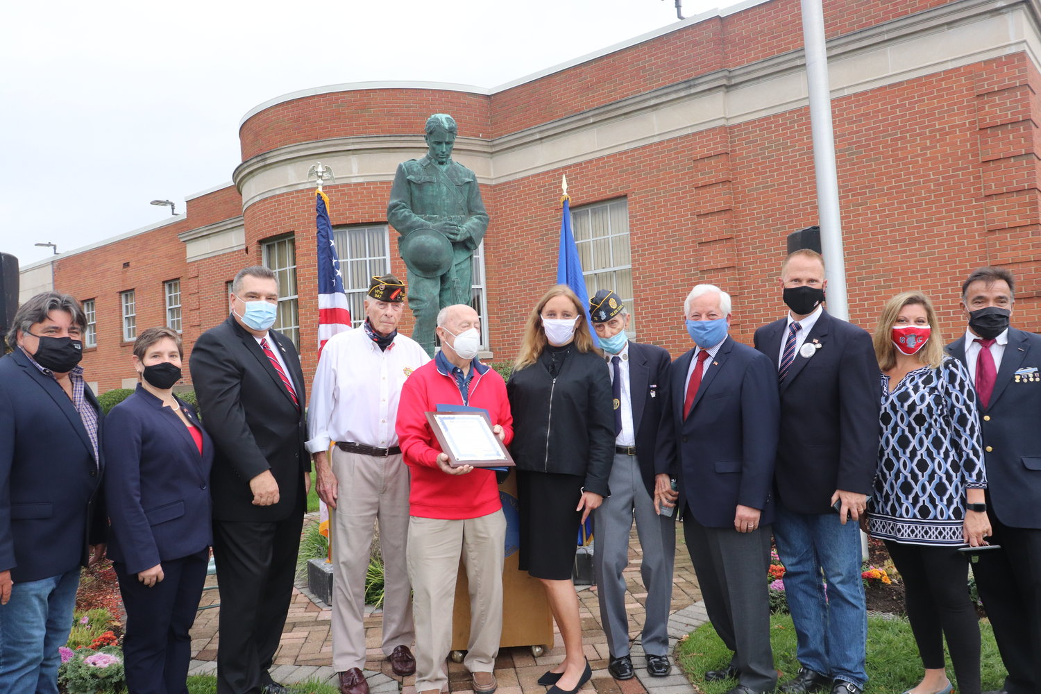 Local officials and veterans gathered at the Glen Cove Doughboy monument to honor veterans on Wednesday.