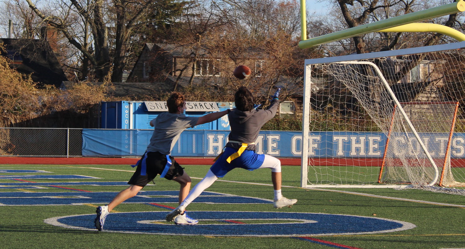 Senior football player Nick Mamay, right, reached for a pass in the end zone.