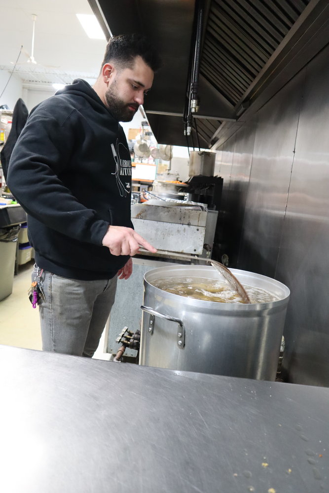 With the help of chefs who cycled shifts throughout the day, Carroll prepared 3,000 meals for local families.
