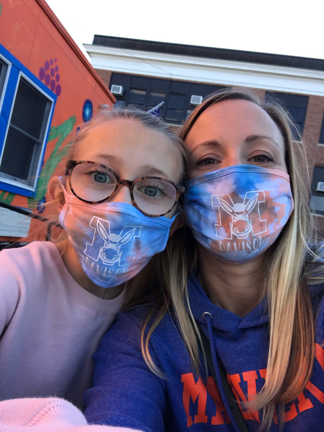Davison Avenue School PTA Co-president Hayley Kelch, and her daughter, Ella, wore custom-made masks to promote the school’s clothing drive.