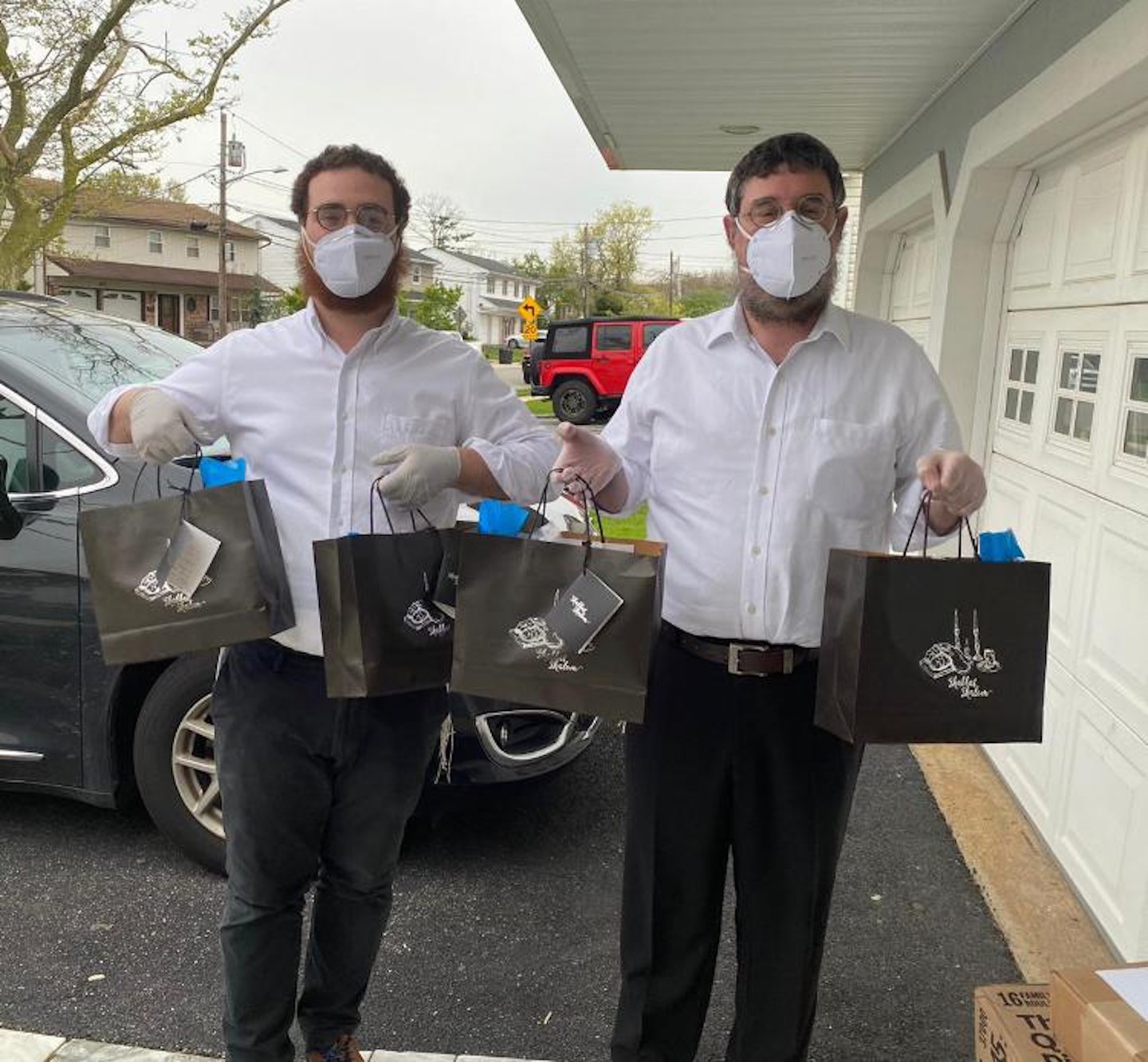 Gurkov, right, and his son-in-law, Zev Bumgarten, affectionately known as Rabbi Zev, delivered care packages to residents after the pandemic struck.