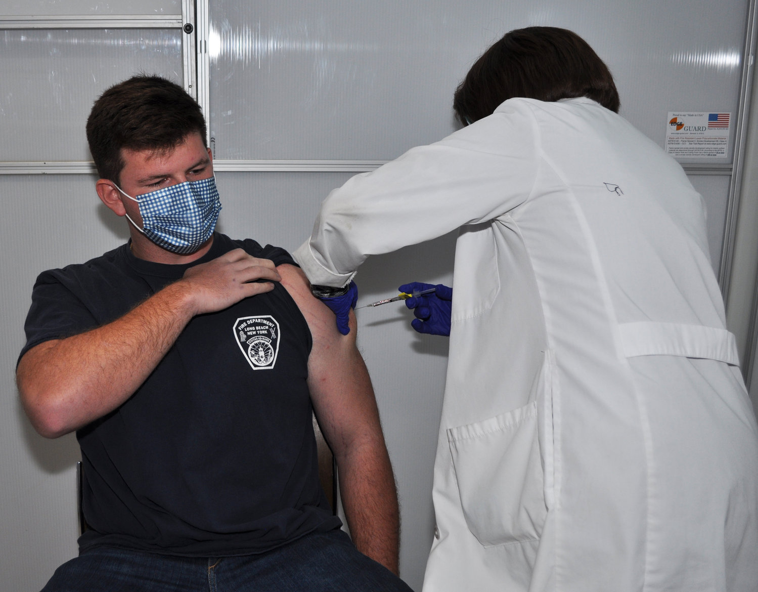 Long Beach firefighter Joshua Schwimmer received his first dose of the coronavirus vaccine at Mount Sinai South Nassau.