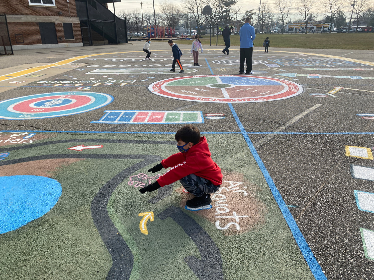 Students participated in fun exercise routines using the activity wheel in the schoolyard.