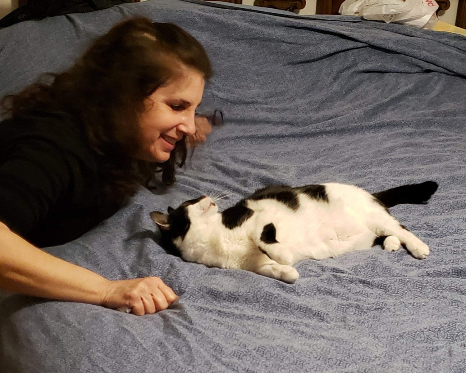 Stasie Fishman has an affectionate relationship with her feline friends. Here, the Merrick resident is pictured with Bettinna, the star of her book “Bettinna’s Tail.”