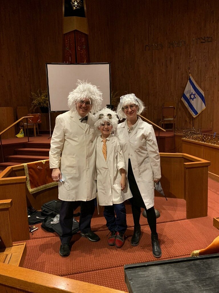 At Congregation Ohav Sholom, in Merrick, the Ebbin family — Rabbi Ira, Isaac and Chevi — went a little mad for Purim by dressing up as mad scientists.
