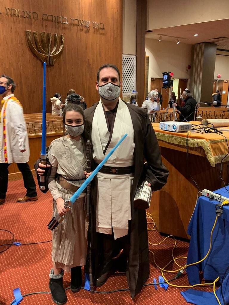 Congregants Uri Leibowitz and his daughter, Ella, used the force while putting together their Purim costumes.