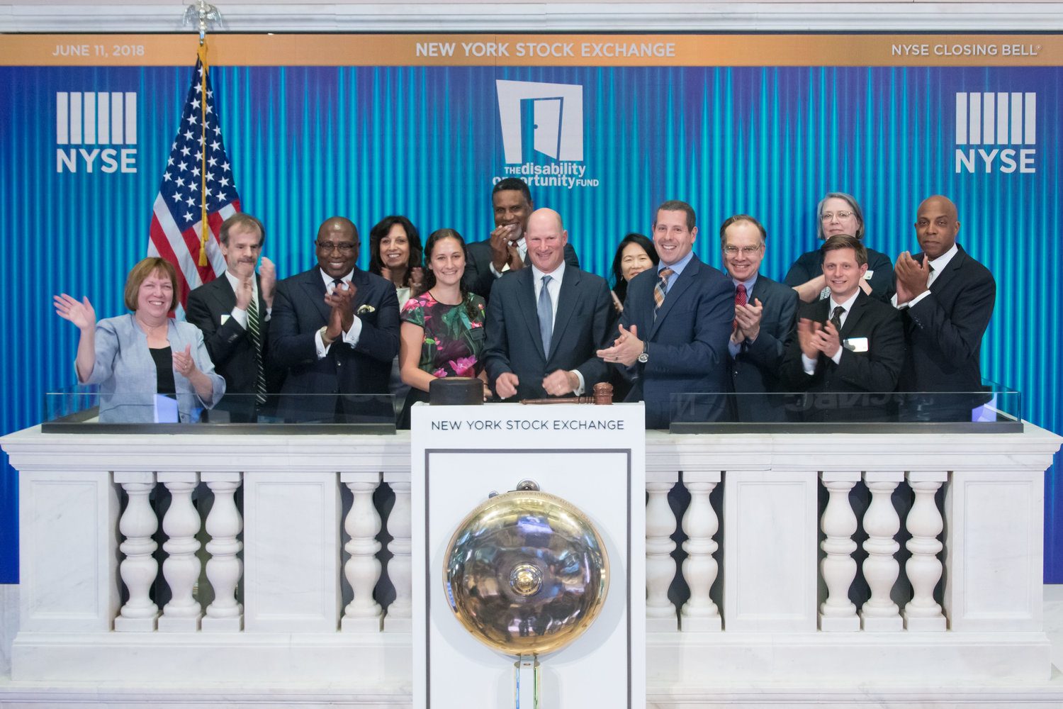 Charles Hammerman, center, president and CEO of Rockville Centre-based Disability Opportunity Fund, rang the closing bell at the New York Stock Exchange on the 10th anniversary of his nonprofit in 2017.