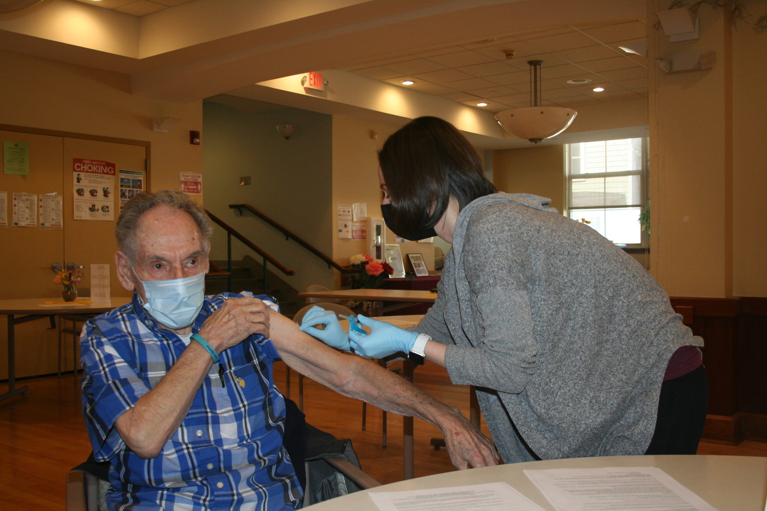 Ty Gonzalez, 90, received his vaccine from Americare nurse Christine D’Angelo at the Life Enrichment Center of Oyster Bay.