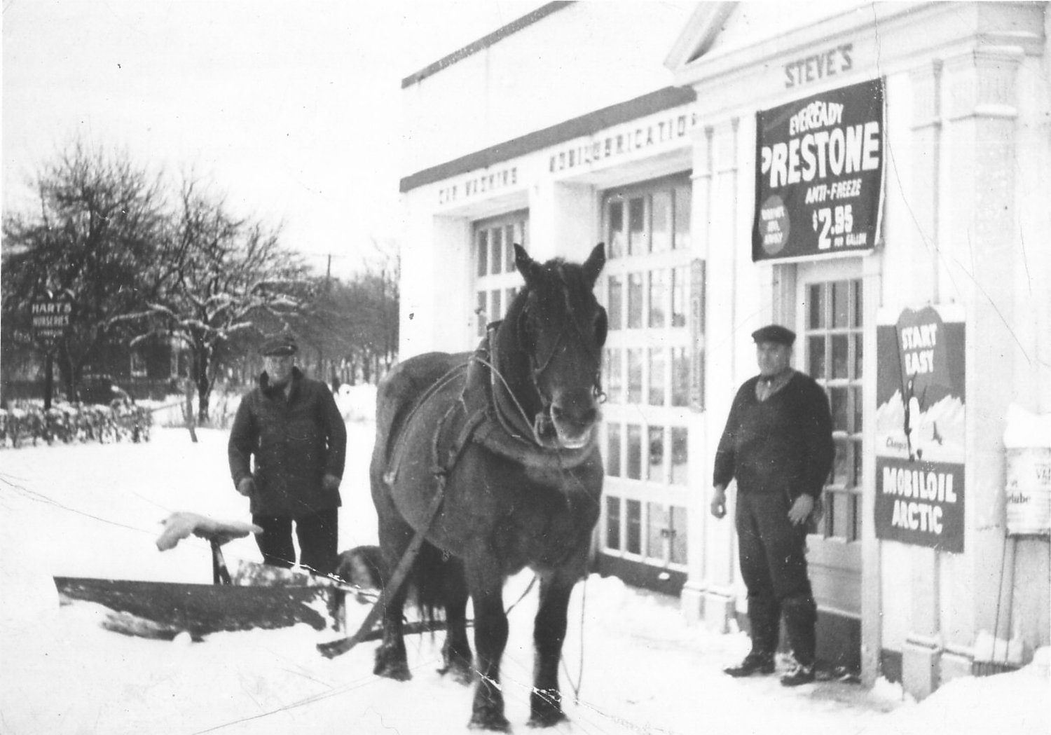Plowing snow with a one horse-power engine, in 1934. This is Steve’s Garage, at the corner of Hempstead and Lakeview avenues.
