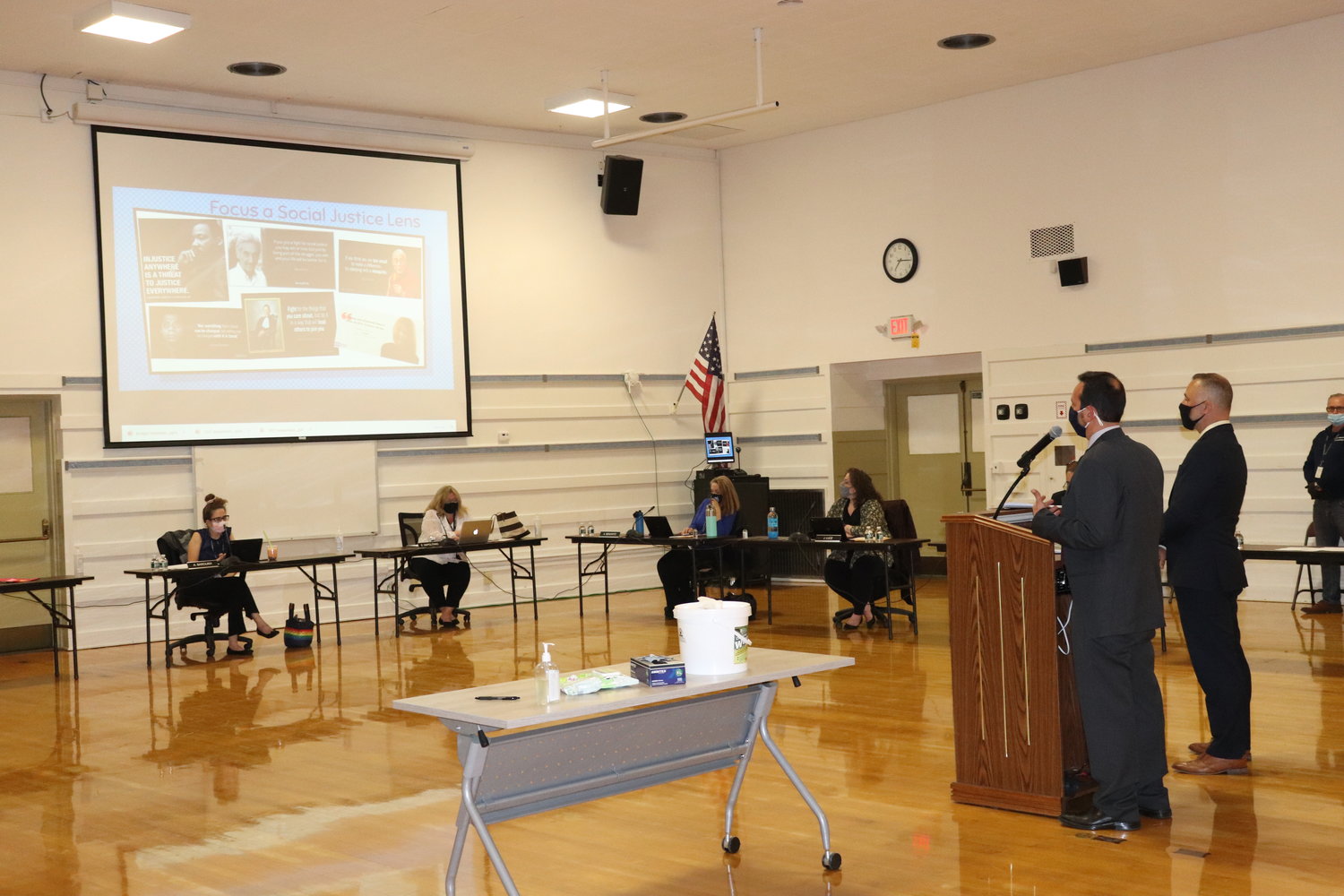 Jim Mendonis, director of social studies and 21st century learning, left, and Frank Lukasik, director of literacy and funded programs, discussed the importance of time, access and choice of books with diverse characters and storylines with the East Meadow Board of Education.