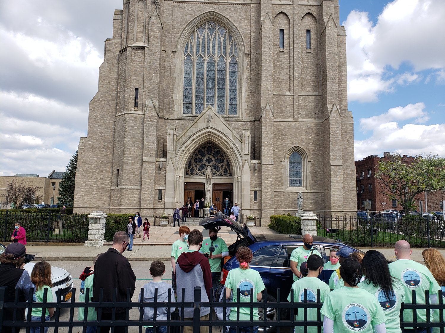 Dozens gathered outside St. Agnes Cathedral in Rockville Centre last Sunday to protest the closures of three Catholic schools.