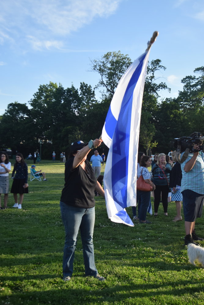 Manhattanite Karen Lichtbraum hoisted the flag of Israel at the rally.
