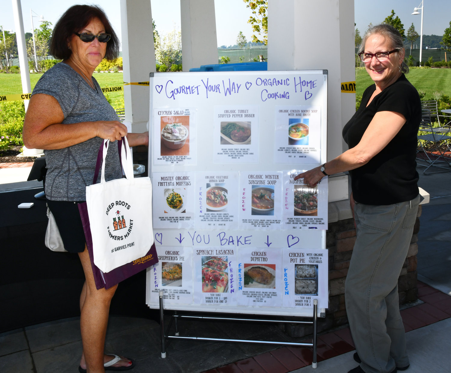 Maureen Hauser and chef Alison Prudente looked over Prudente’s menu for Gourmet Your Way organic home cooking