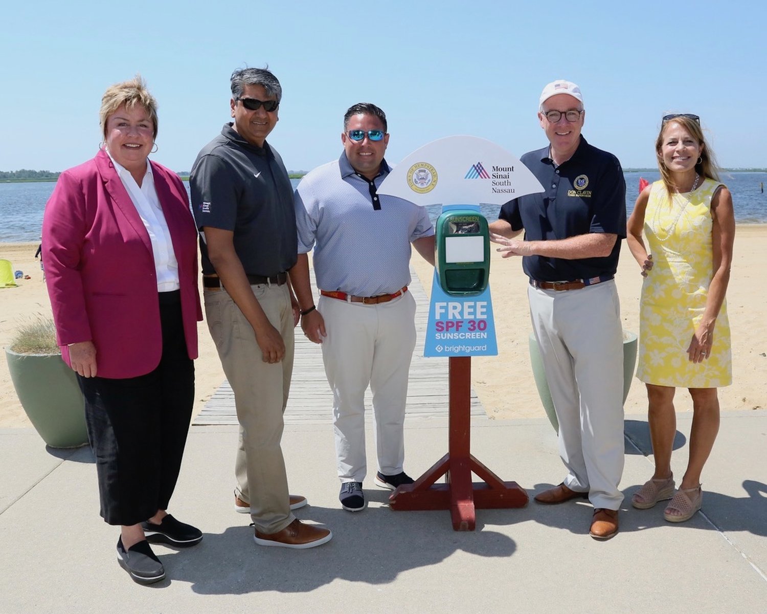 Town of Hempstead officials and Mount Sinai South Nassau have partnered to provide sunscreen at town-operated beaches and pools. Taking part were, from left, Town Clerk Kate Murray, MSSN Chief Medical Officer Dr. Adhi Sharma, Councilman Anthony D’Esposito, Supervisor Don Clavin and Receiver of Taxes Jeanine Driscoll.
