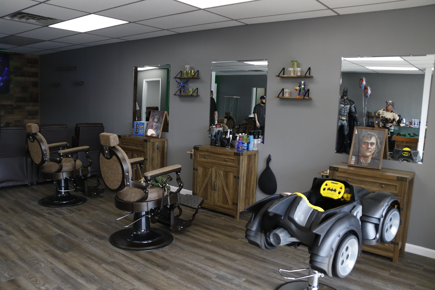 The barbershop features many comic book characters for children of all ages.