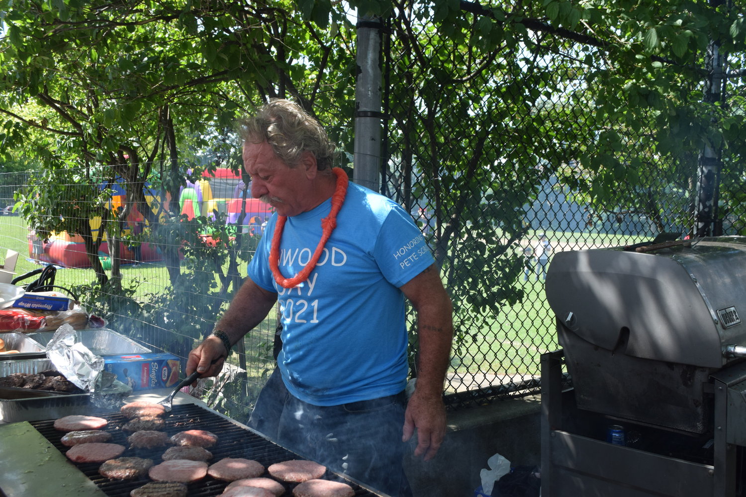 Tony Nave was at the grill all day cooking the hamburgers.