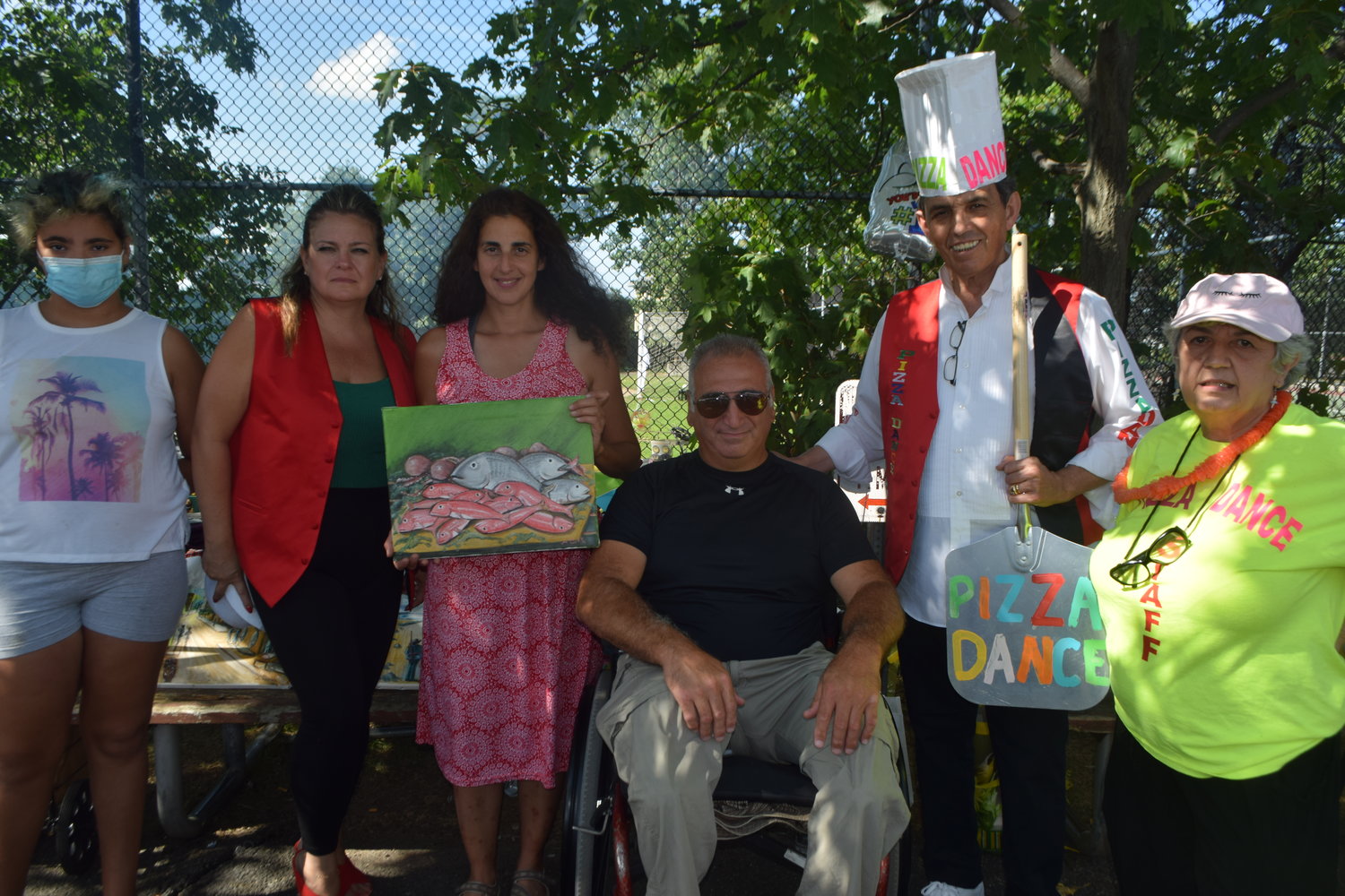 Crafts and paintings were on sale at Inwood Day  and from left Isabella Iaseboli, Kathy Leon, Valeria and Massimo Perella, Tony Modica and Mariarosa Guzzardi.