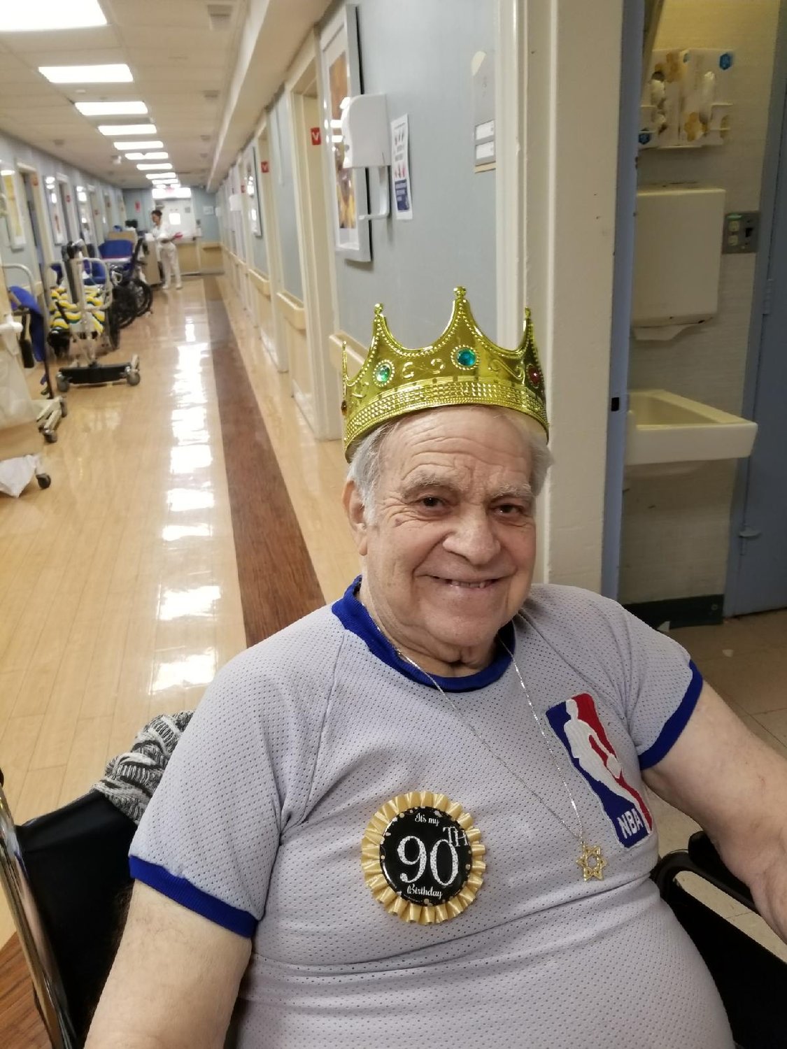 Manny Sokol celebrating his 90th birthday in a recreation of his NBA referee uniform at the Oceanside Care Center.