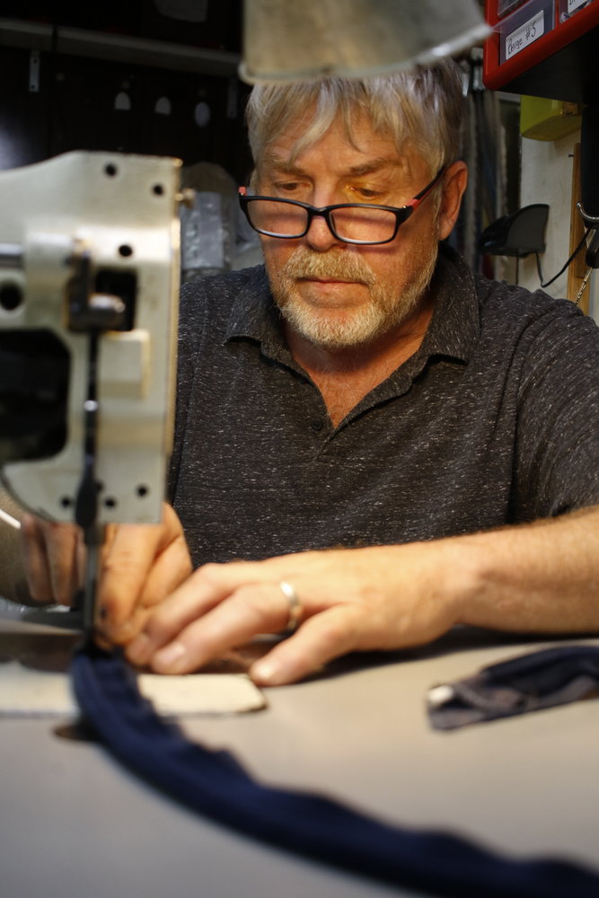 Michael Shannon, owner of East Meadow Upholsterers, didn’t know how to sew when he took over the shop after his father-in-law retired. Now he is an expert at it.