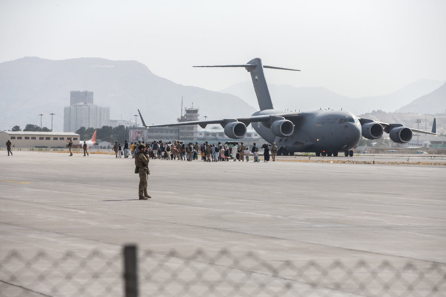 The civilian evacuation at Hamid Karzai International Airport in Kabul on Aug. 21, five days before the attack that killed as many as 170 Afghan civilians and 13 U.S. service personnel.