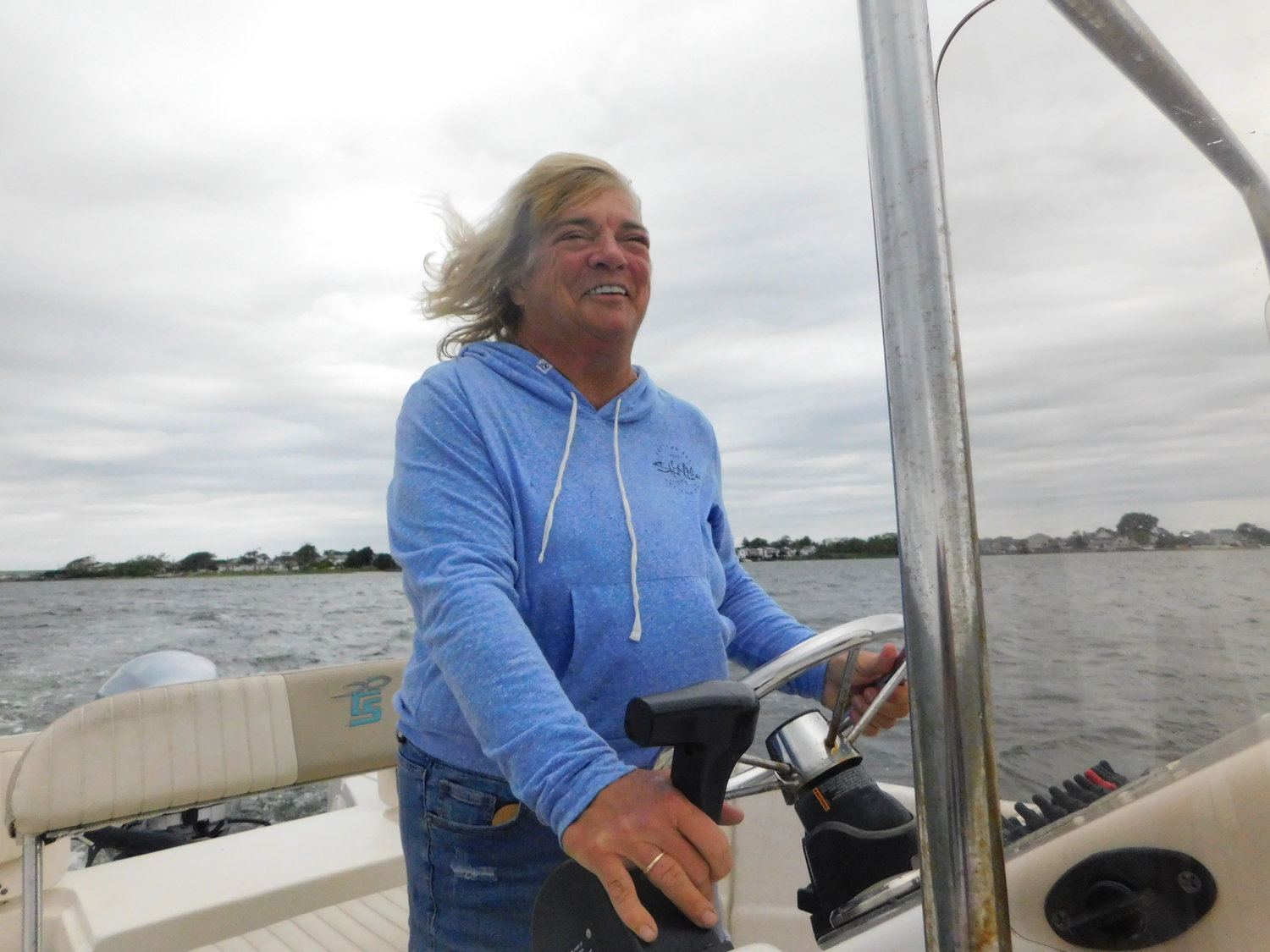 Sue Lyons steered her center console outboard boat from her Freeport home to the bay house.