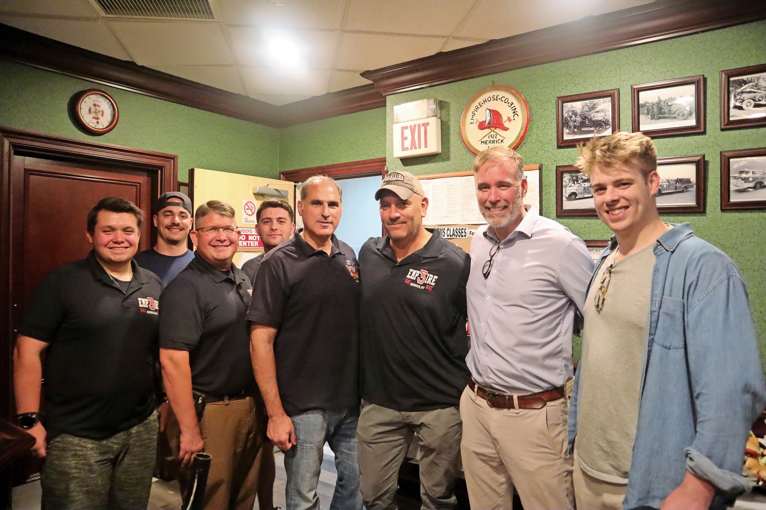 Firefighters, from left, Connor Clement, Lucas Gerrato, former Chief Chris Clement, firefighter Kyle Radtke and Ron Luparello, with firefighter and Big Media CEO Jon Loew, Phil Reilly and Reilly’s son.