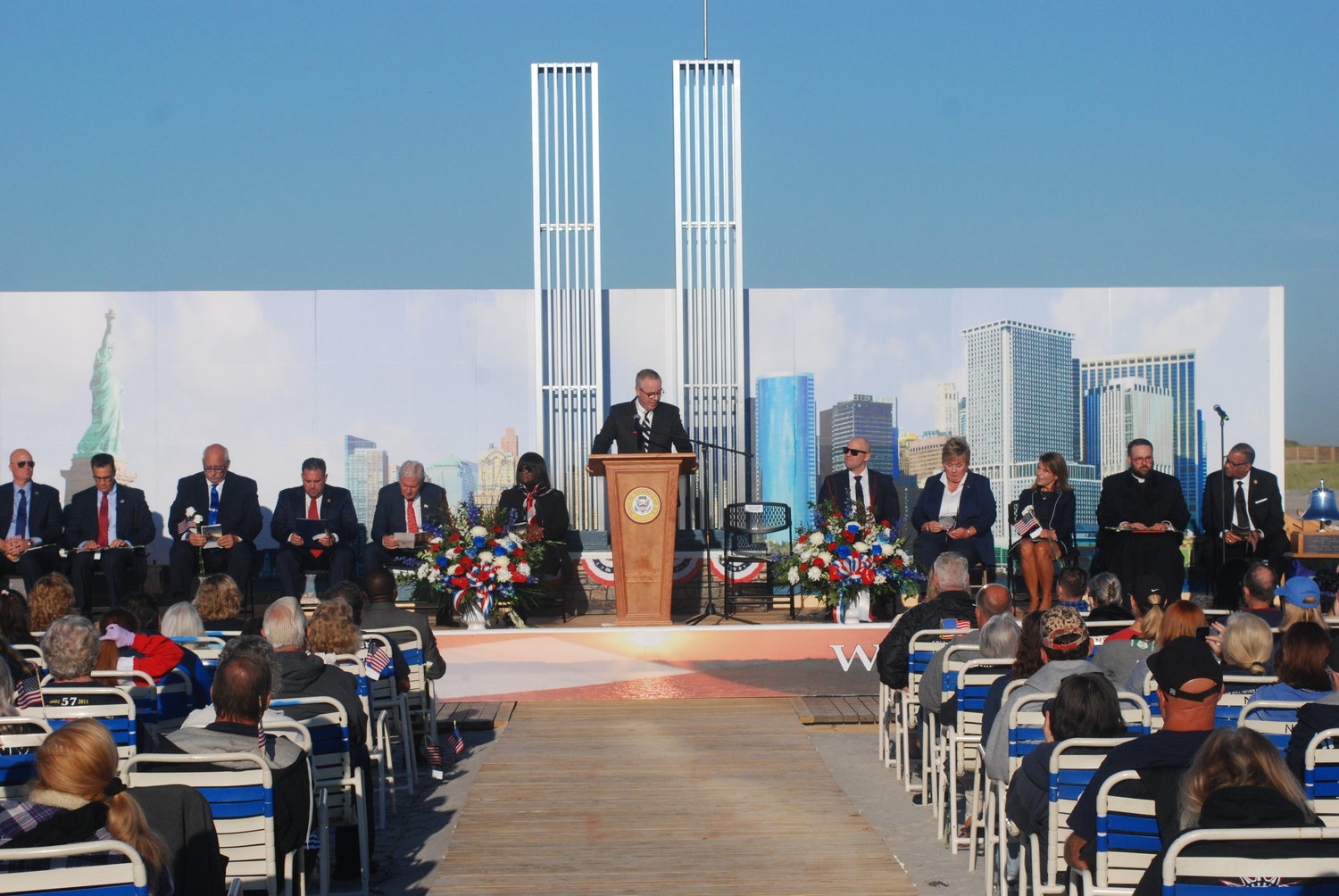 Two aluminum replicas of the twin towers formed the backdrop for the ceremony.