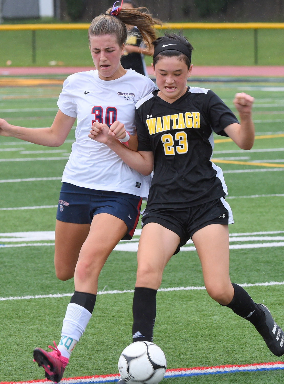 Wantagh's Kate Vezzuto, right, controlled the ball in front of South Side's Anna Pennecke during the season opener for both teams Sept. 9.