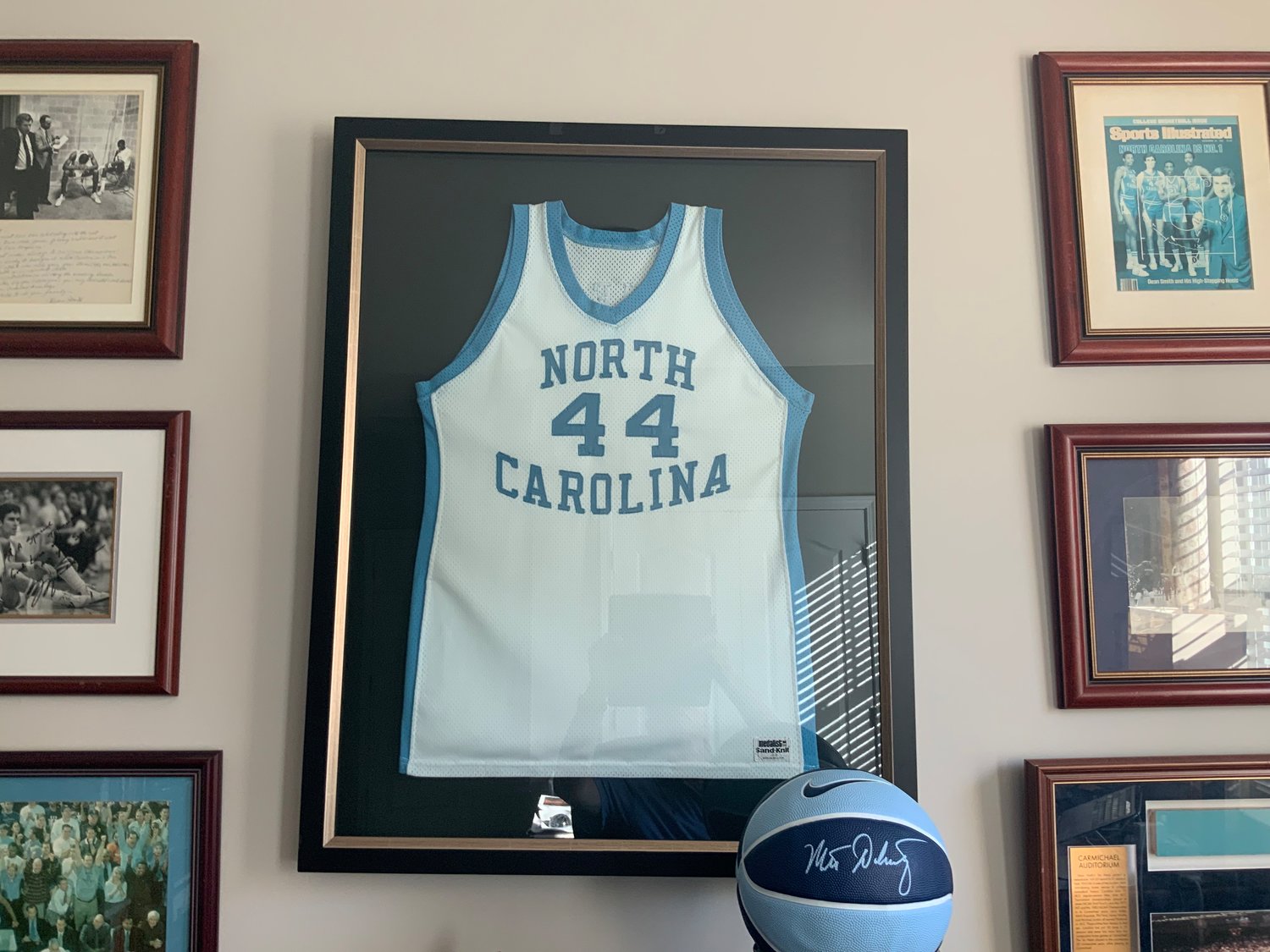 In Doherty’s home office, he displays his UNC jersey among other memorabilia from his basketball career.