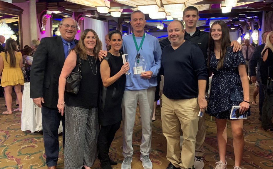 Former Lawrence Woodmere Academy basketball coach Jeff Weiss was inducted into the Nassau County Athletics Hall of Fame last month. From left were Long Beach Athletic Director Arnie Epstein and his wife, Randi, Andrea and Jeff Weiss, John Schandler, and Ryan and Riley Weiss.