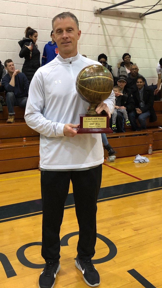 Jeff Weiss after his 600th career win in February 2019, on the court at Lawrence Woodmere Academy that bears his name.
