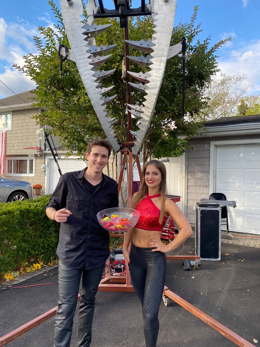 Husband and wife duo Eric and Eliana Wilzig in front of the giant, metal jaws that the former escapes from.