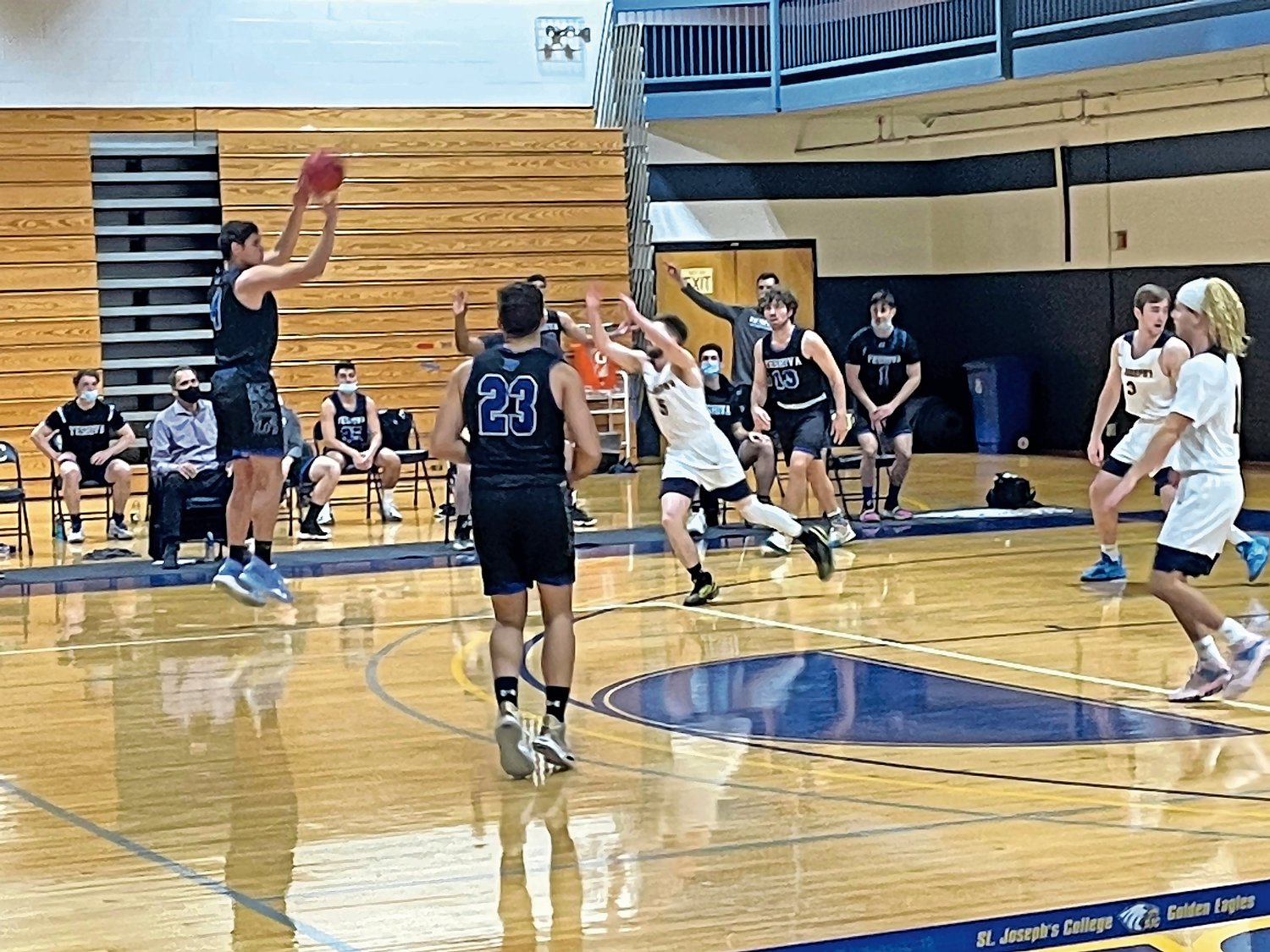 Yeshiva University forward and Lawrence native Gabriel Leifer lifted a 3-point shot in the second half of the Maccabees’ 82-58 win over St. Joseph’s College in Patchogue last Sunday.