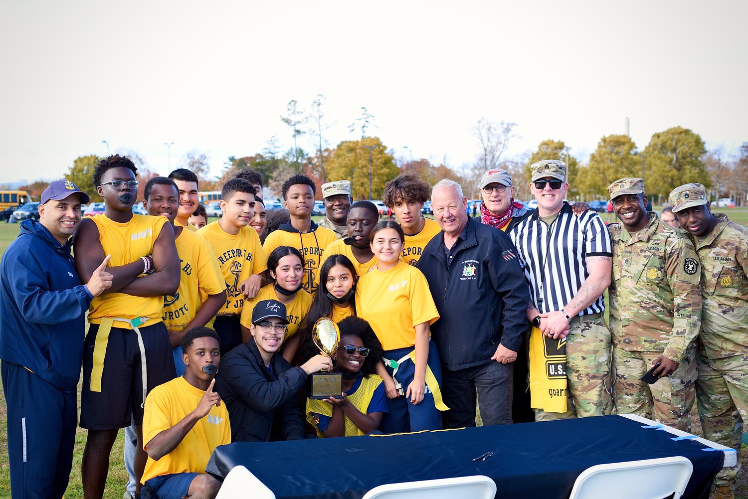 The Freeport JROTC team was joined by military and village officials after the game. Top row, from left:  Chief Lopez; Ethan Cairo; Korey Hillocks; Nick Quintanilla; Mike Rodriguez; Matthew Johnson;   Staff Sergeant Kabore; Alec Bastien; Reymon Gonzalez;  Mayor Robert Kennedy;  Major Don Moore;  Staff Sergeant Roberts; Staff Sergeant Joel Buckmire; Sergeant First Class Byrd. Middle row, from left:  Kimberly Diaz; Catherine Crespo; Kimberly Guatamala. Front row, from left: Michael Bunburry; Justin Moran; Jillian Neblett