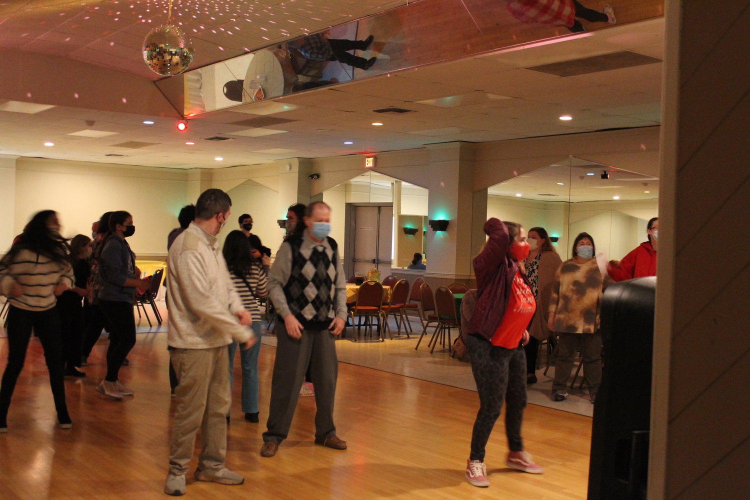 ANCHOR teens and adults dance in the banquet hall of the American Legion Post 854.