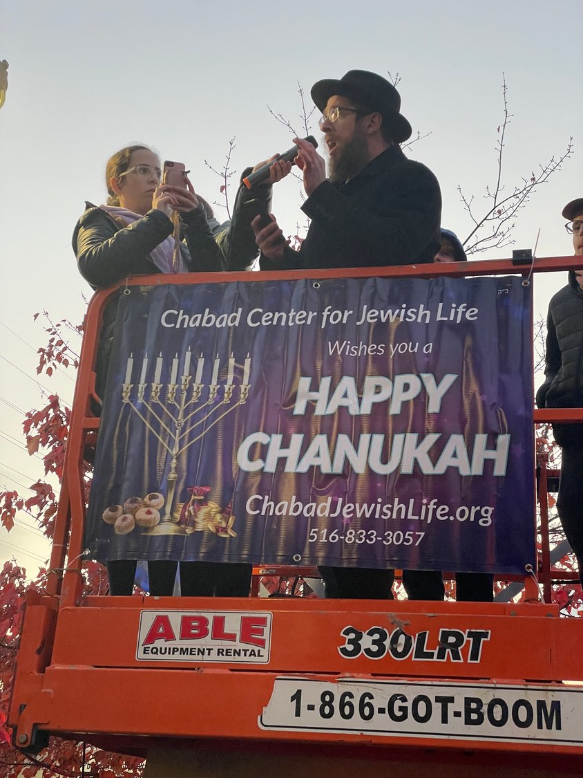 Rabbi Kramer kicked off the menorah lighting with a holiday message and a prayer.