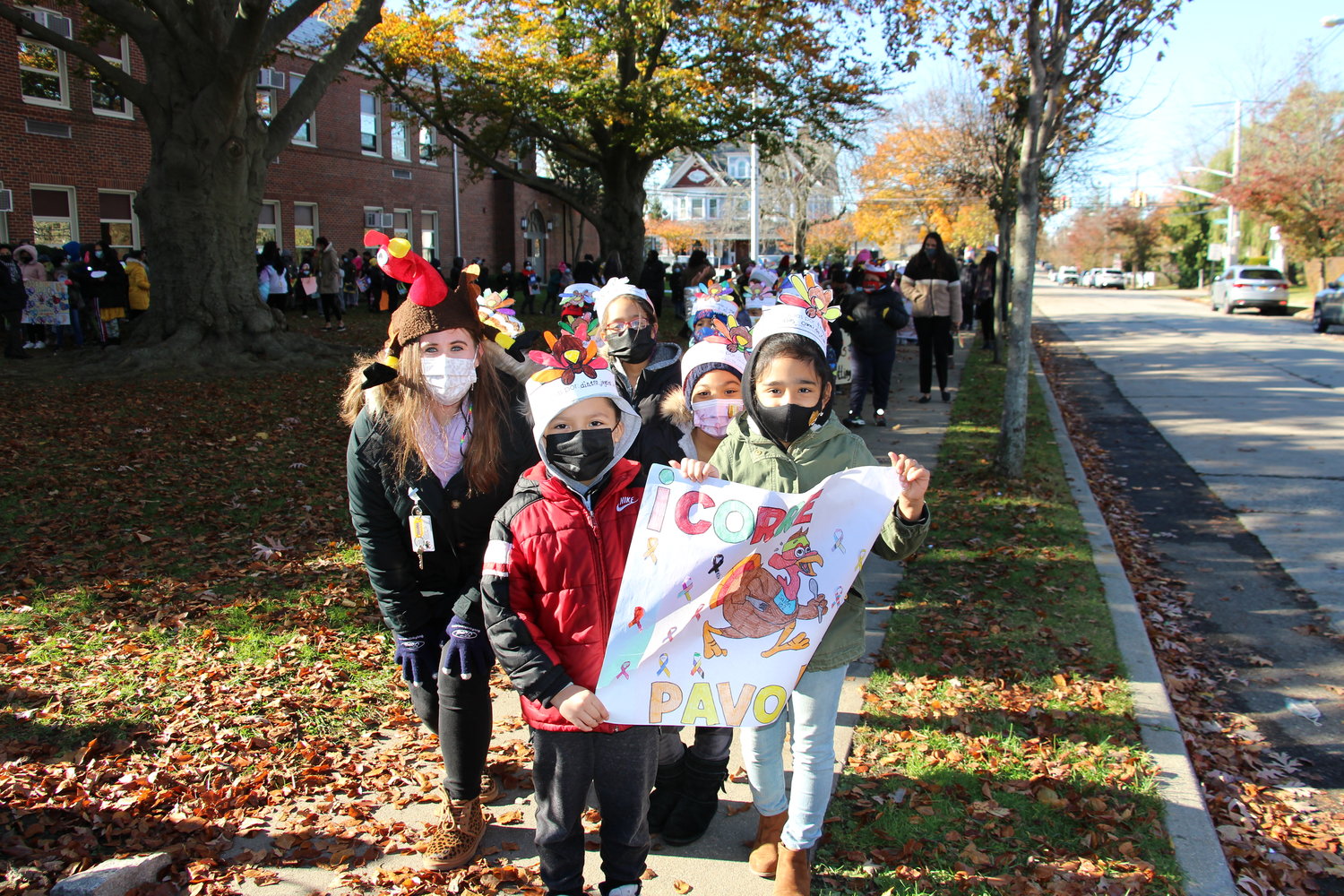 Students displayed their turkey hand puppets during the annual Archer Street Turkey Trot.