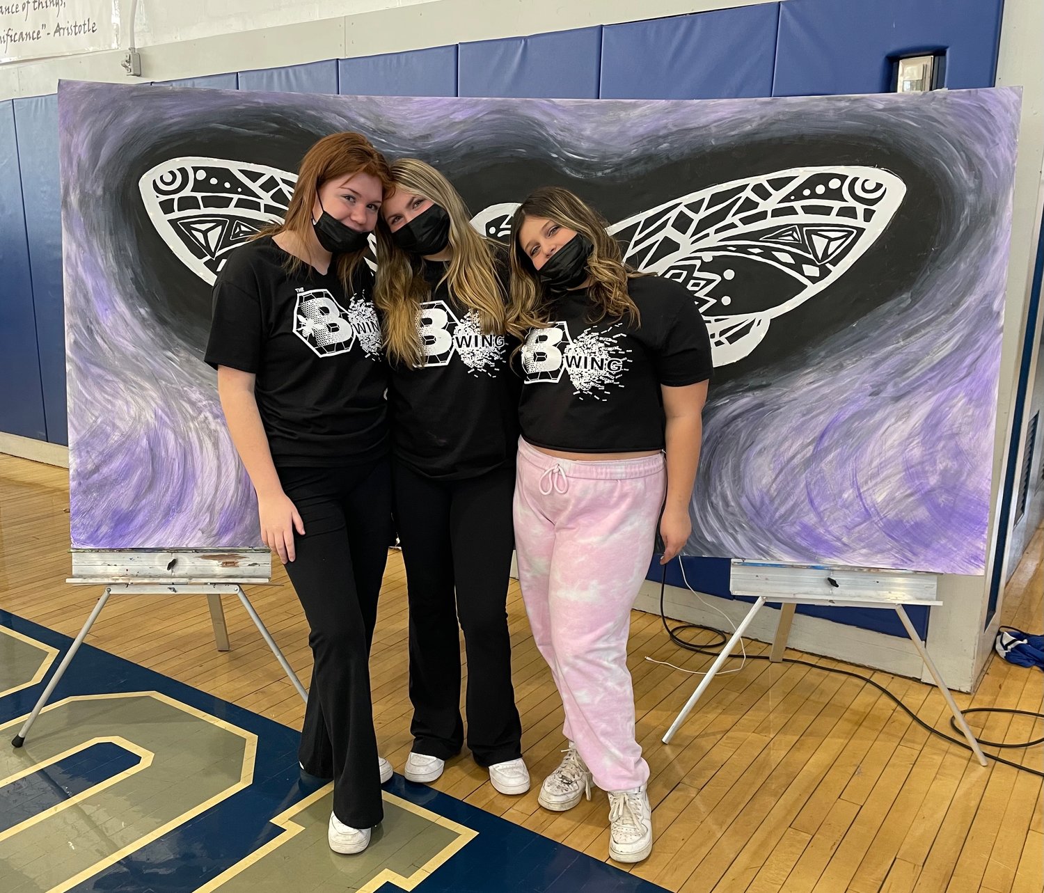 Calhoun students Natalia Lesniewski, Emma Swirsky and Carlee Hanna with their visual display, which students were able to use as a backdrop.