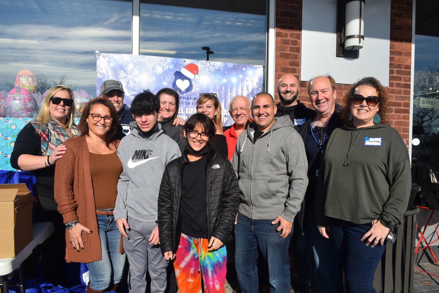 Project Thank A Cop held its second annual Michael Geraldi-Ray Abear Holiday Shop with a Cop at Matty’s Toy Stop in Hewlett on Dec. 4. From left in back were Maegan and Andy Fox, Candace Kearny, Barbara Kartalis, Jim McQuade, Brian Goldstein and David Friedman. From left in front were Carmen, Luca and Mia Geraldi, Patrick Collins and Christie Goldstein.